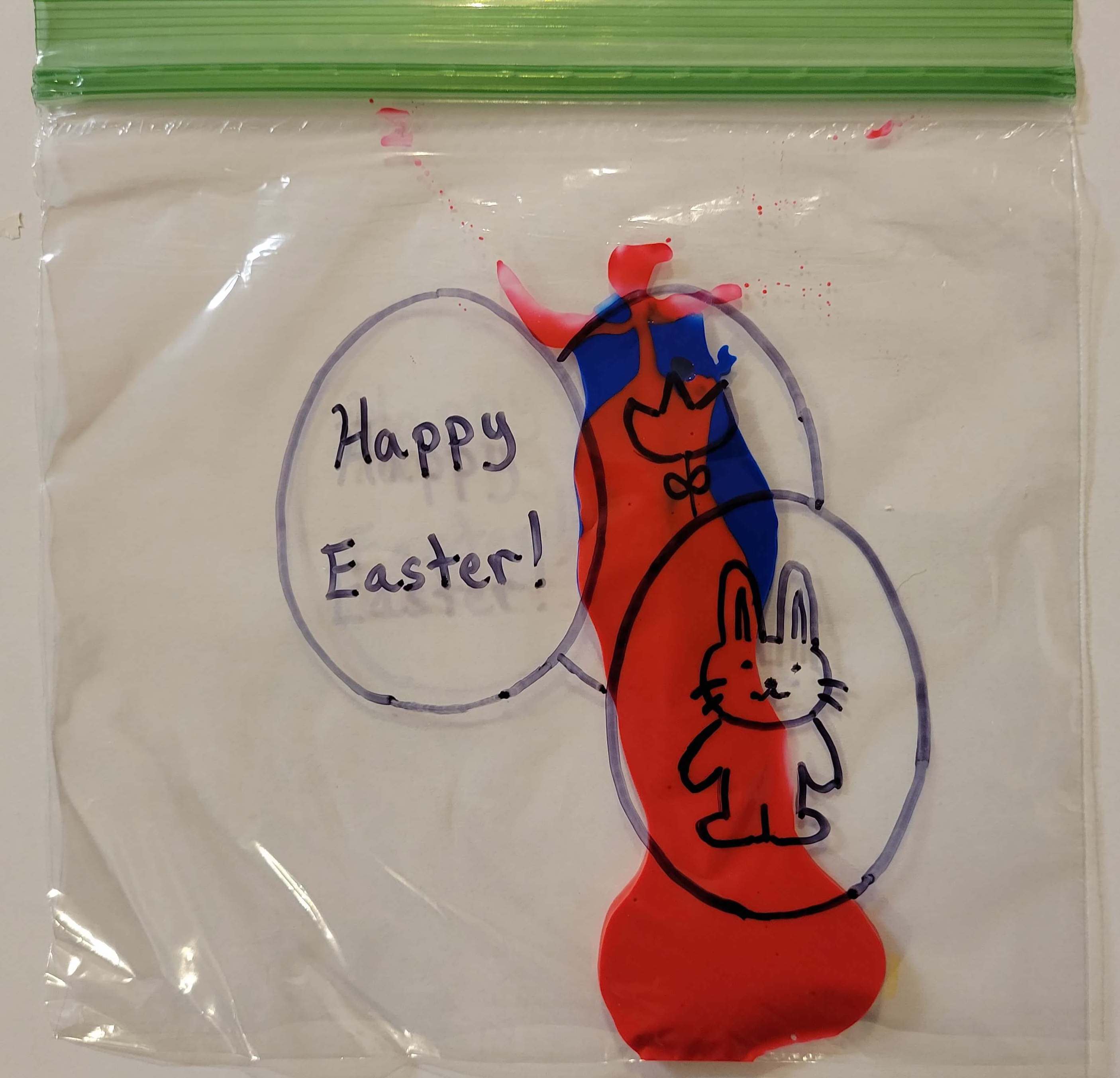 Red and blue paint in a bag