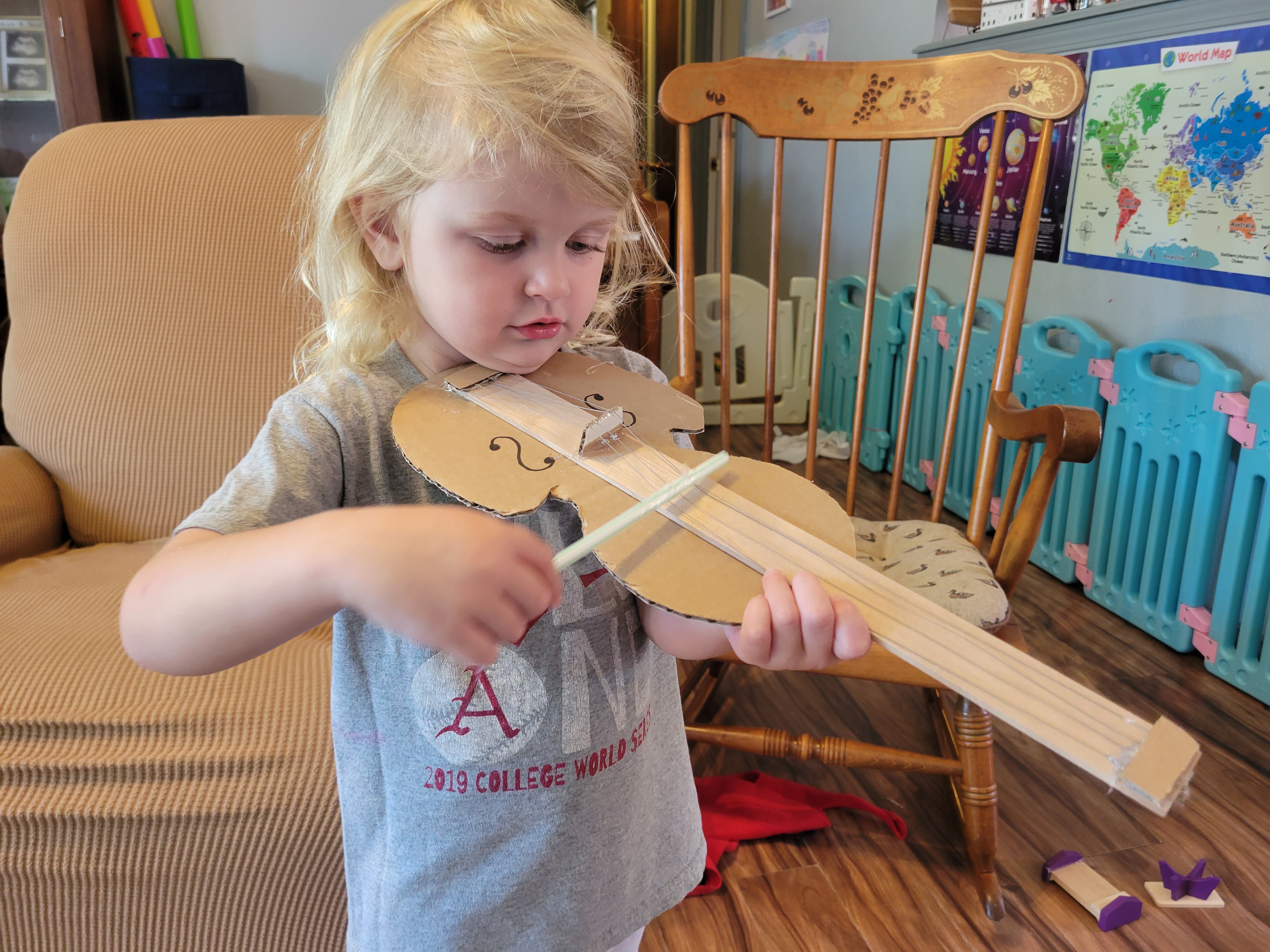 Preschooler playing pretend Violin
