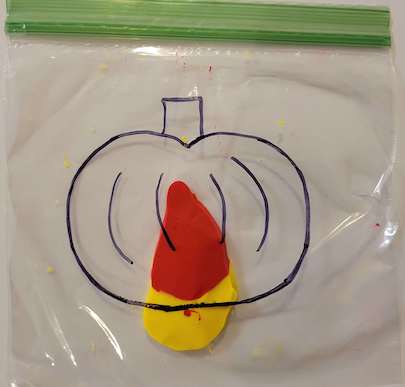 Yellow and red paint in a bag